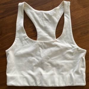 Girlfriend Collective racerback sports bra in color ivory